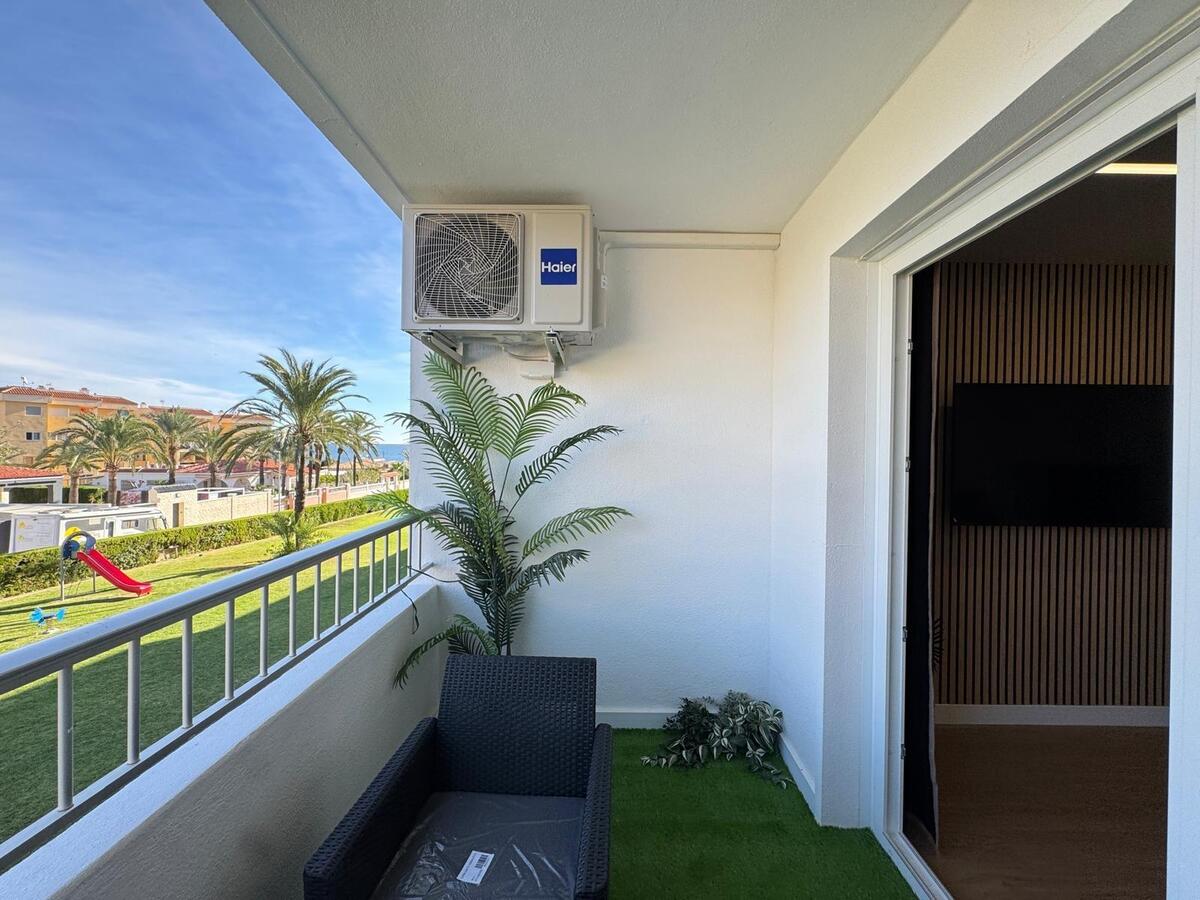 Elegantly renovated apartment for sale with sea views near the beach in Punta Prima.